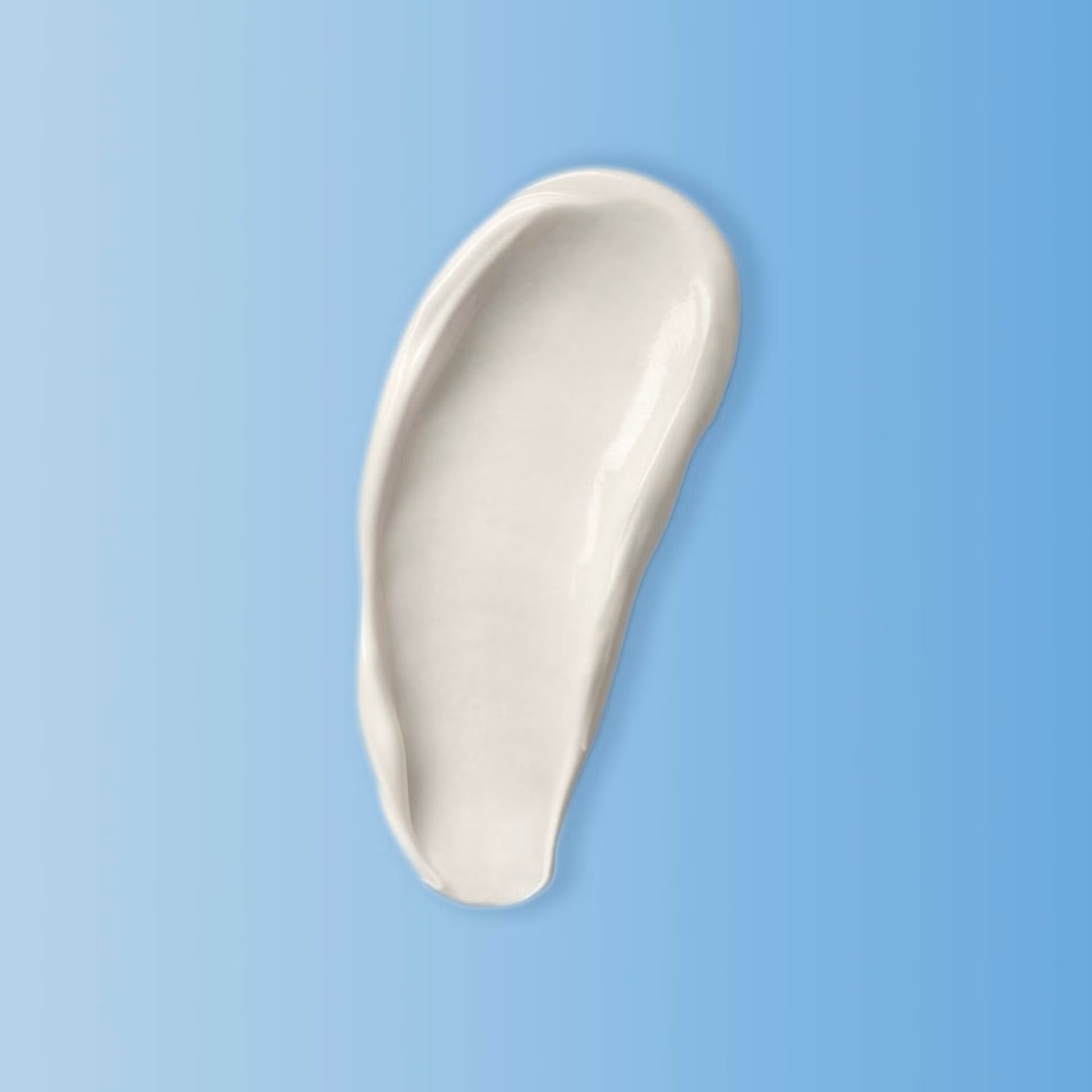 White ceramic spoon rest on a light blue background