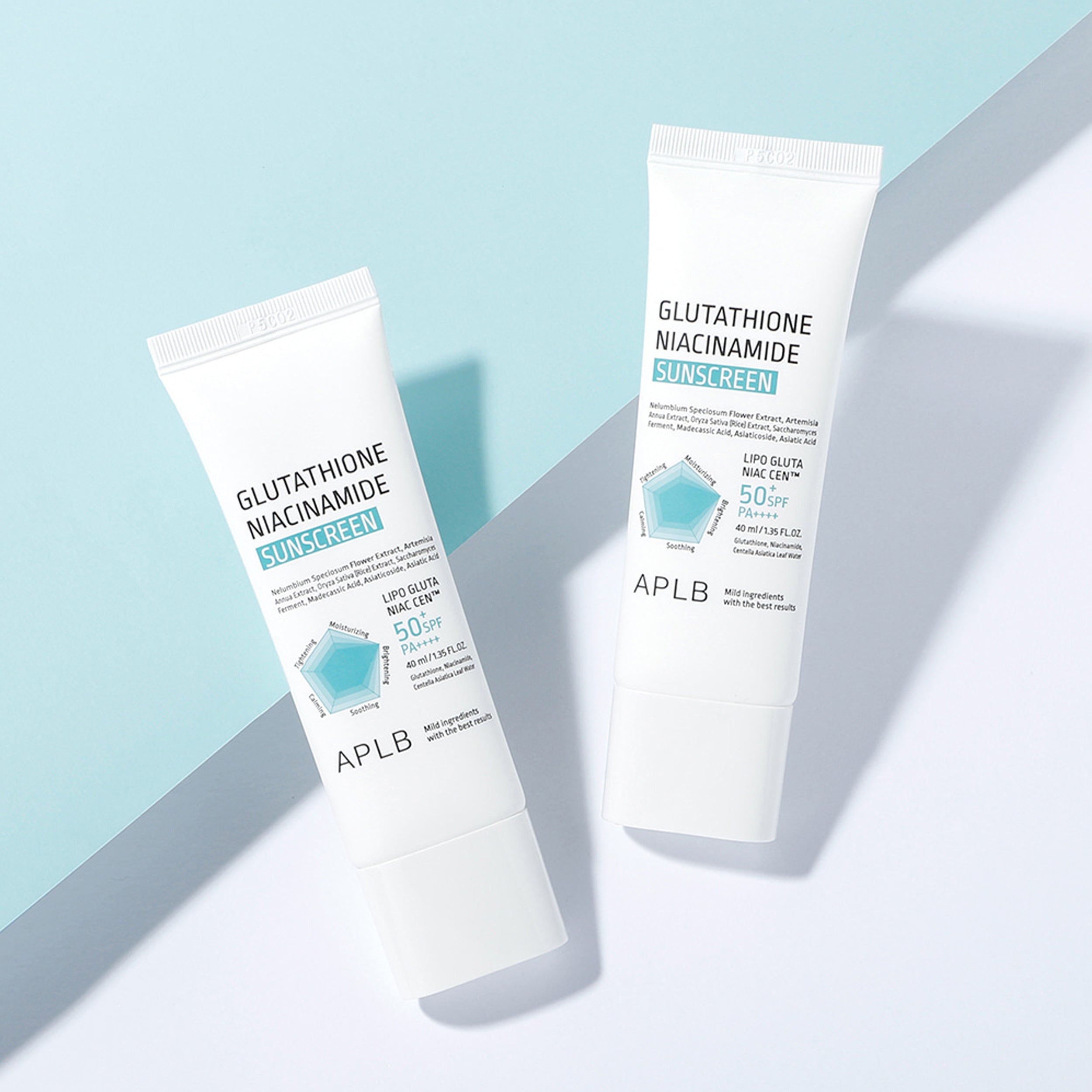 Two tubes of APLB Glutathione Niacinamide Sunscreen on a light blue and white background