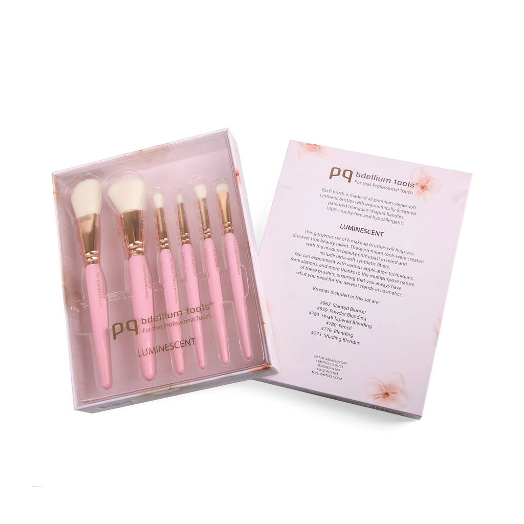 Set of pink makeup brushes in a box with 'pq beauty tools' branding.