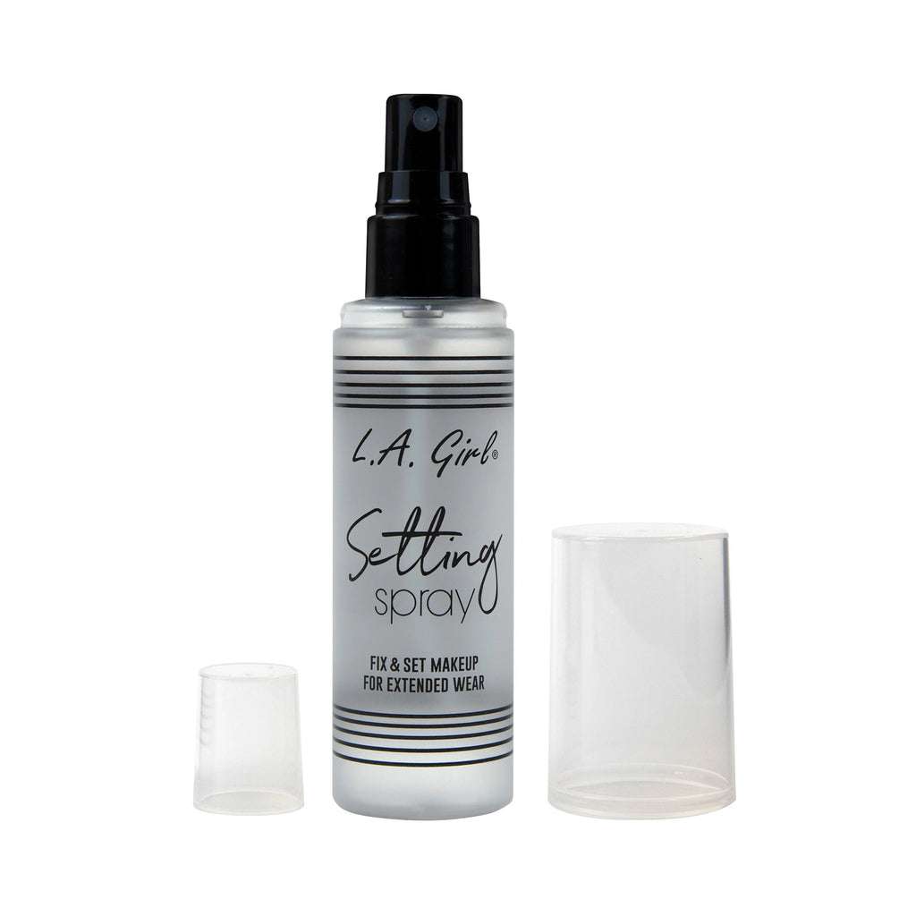 L.A. Girl setting spray bottle with black cap and label on a white background