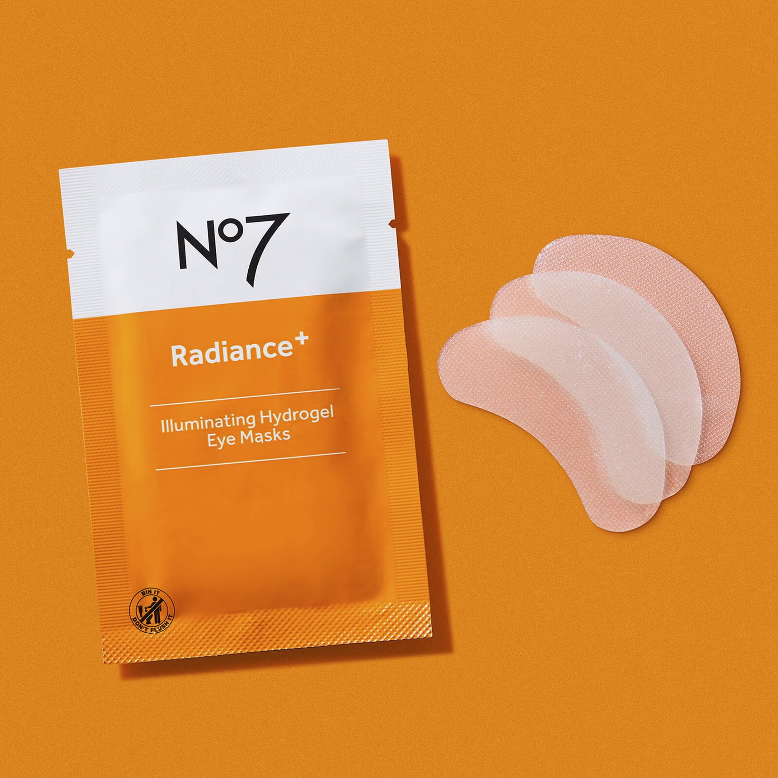 No7 Radiance+ Illuminating Hydrogel Eye Masks on an orange background